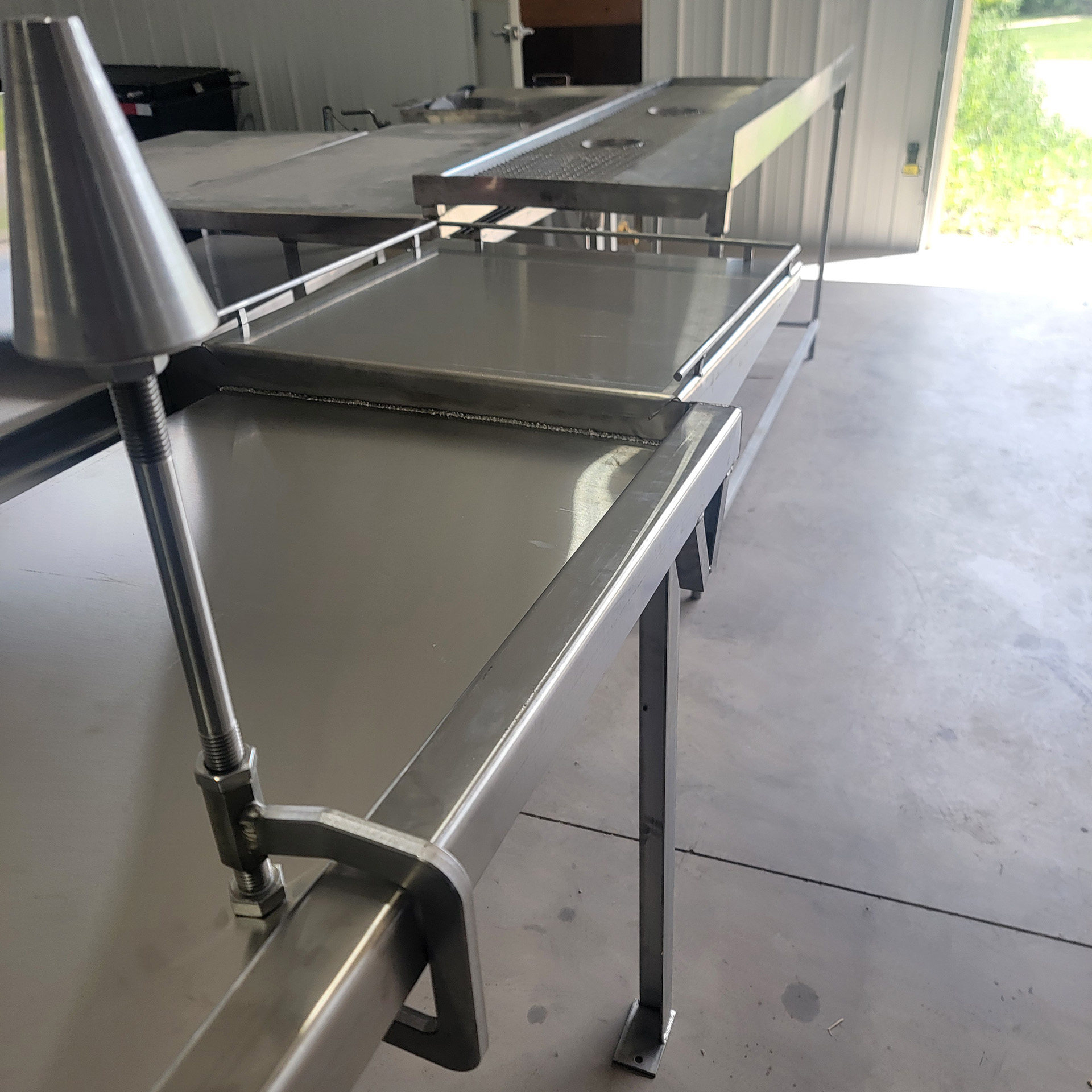 deboning cone clamped to table.